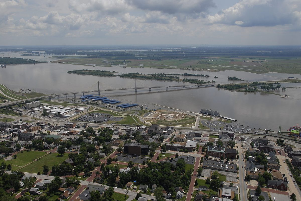 Aerial view of Alton during the June 2008 Mississippi River flood, with the riverfront, a cable-stayed bridge across wide brown water and the town in the foreground
