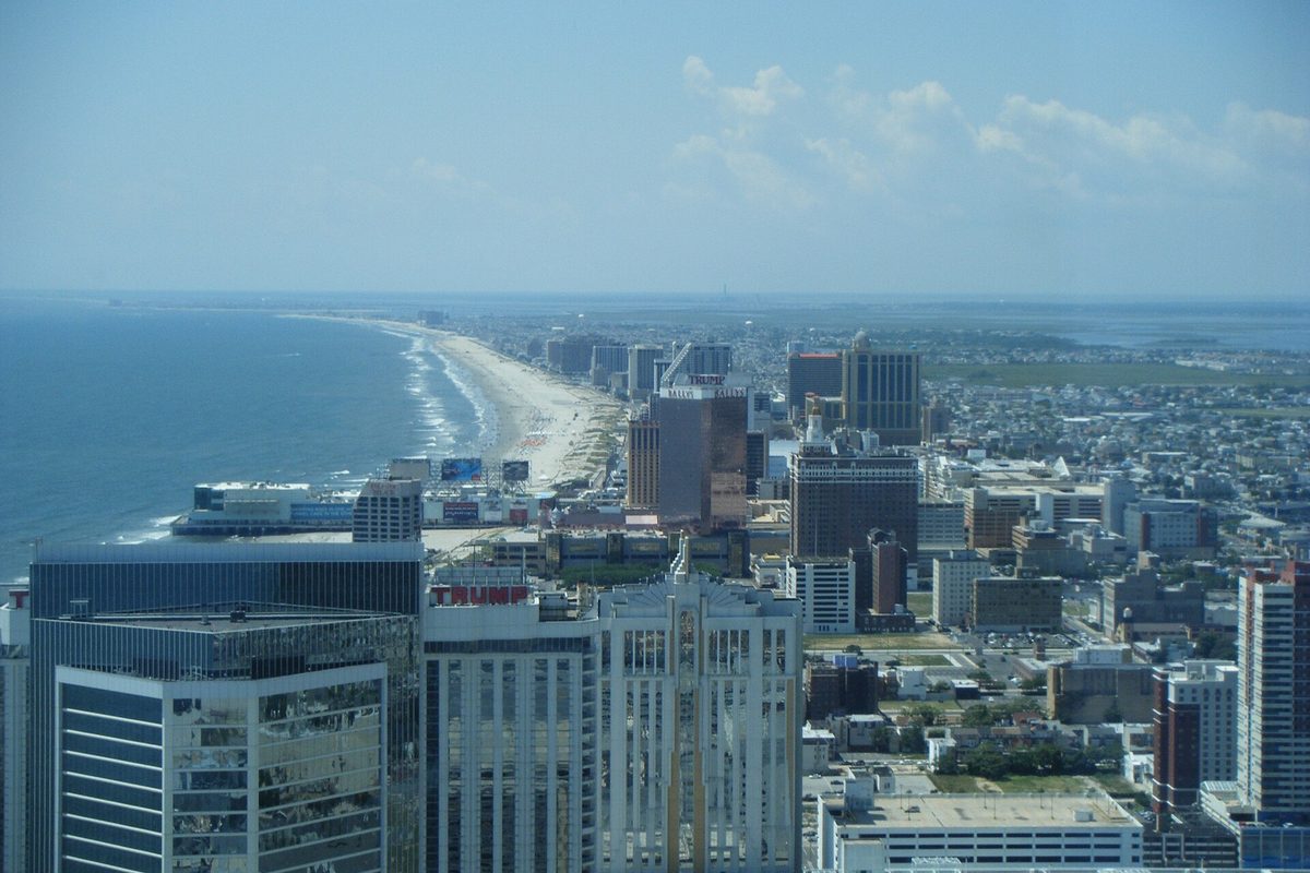 Atlantic City's high-rise hotels and the long beach beside the ocean, seen from high above the city looking southwest