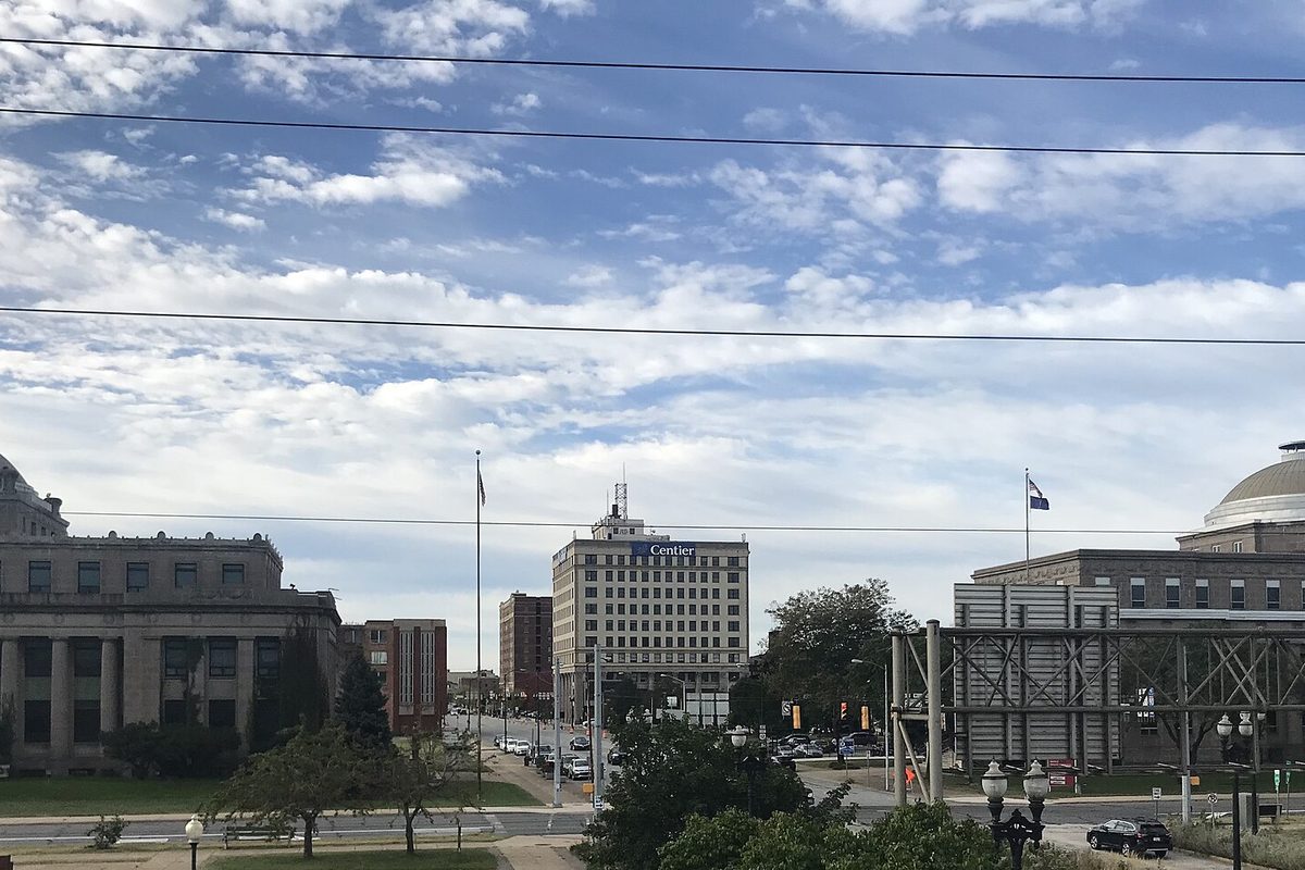 Downtown Gary seen from the South Shore Line station: a columned stone building on the left, a domed building on the right and an office tower between them
