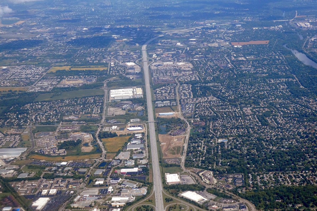 Aerial view of Interstate 270 running through Hilliard, with subdivisions, warehouses, office parks and a few open fields on either side