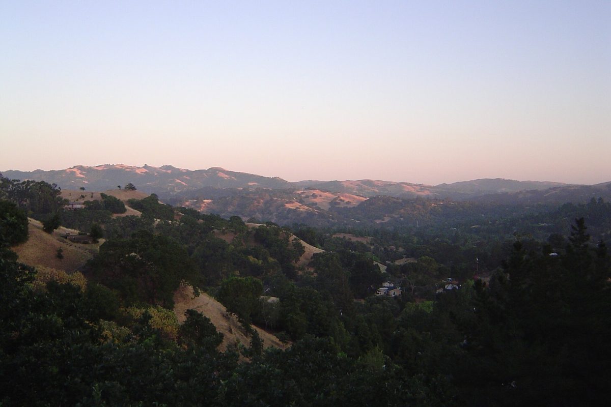 Oak-covered hills and dry grassy ridges around Lafayette in the soft light of dusk