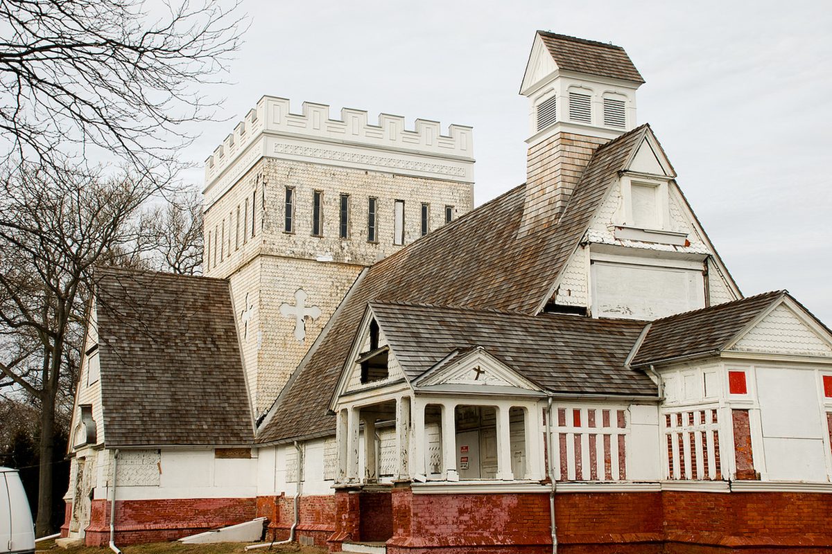 The Church of the Presidents in Long Branch, a shingled Victorian church with a crenellated tower, a belfry and a weathered red base