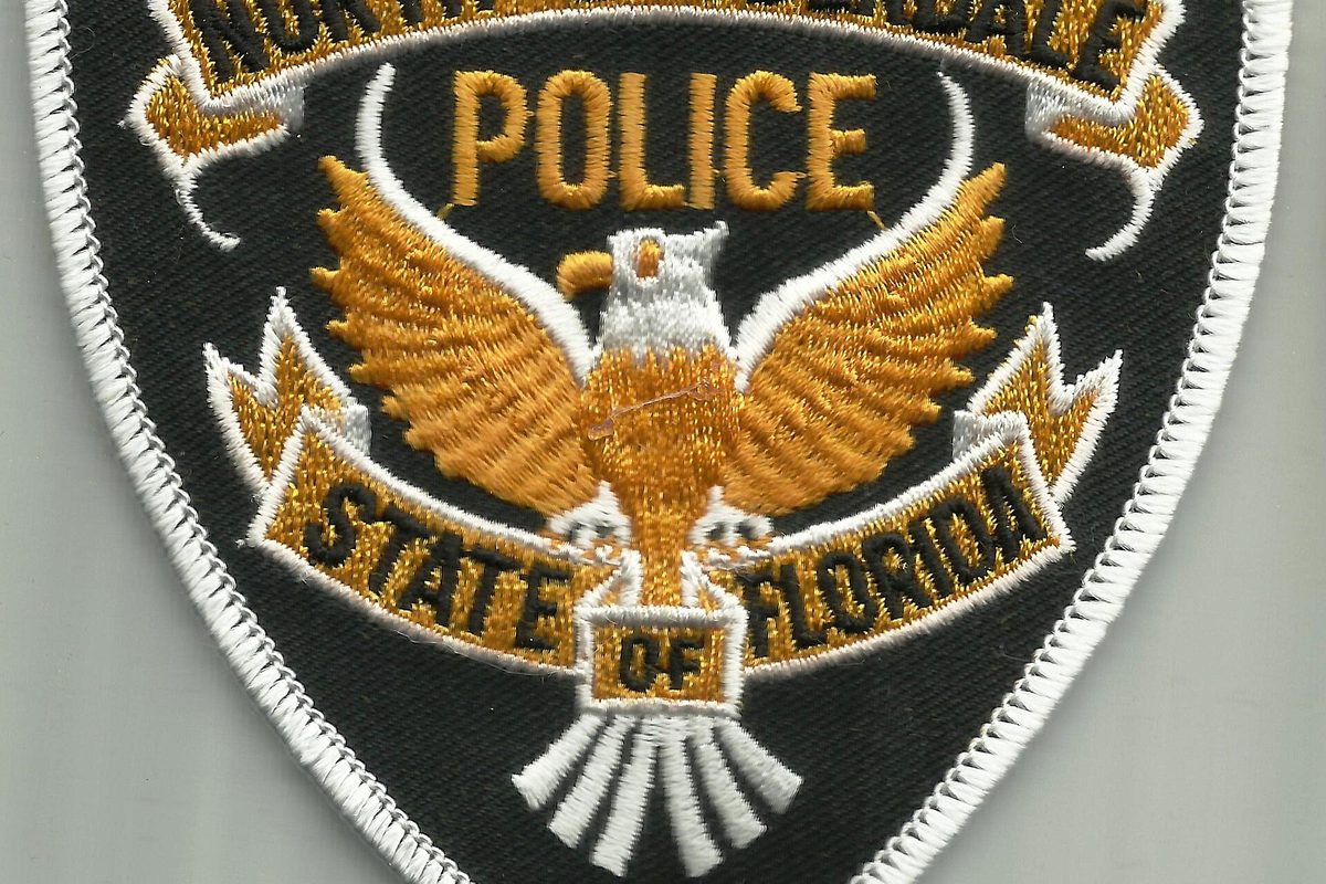 An embroidered North Lauderdale police shoulder patch with a gold eagle, the word Police and a State of Florida banner