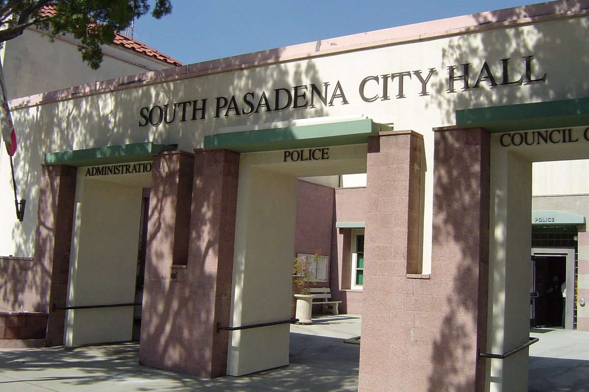 The entrance to South Pasadena City Hall, with pink stone pillars and doorways marked Administration, Police and Council